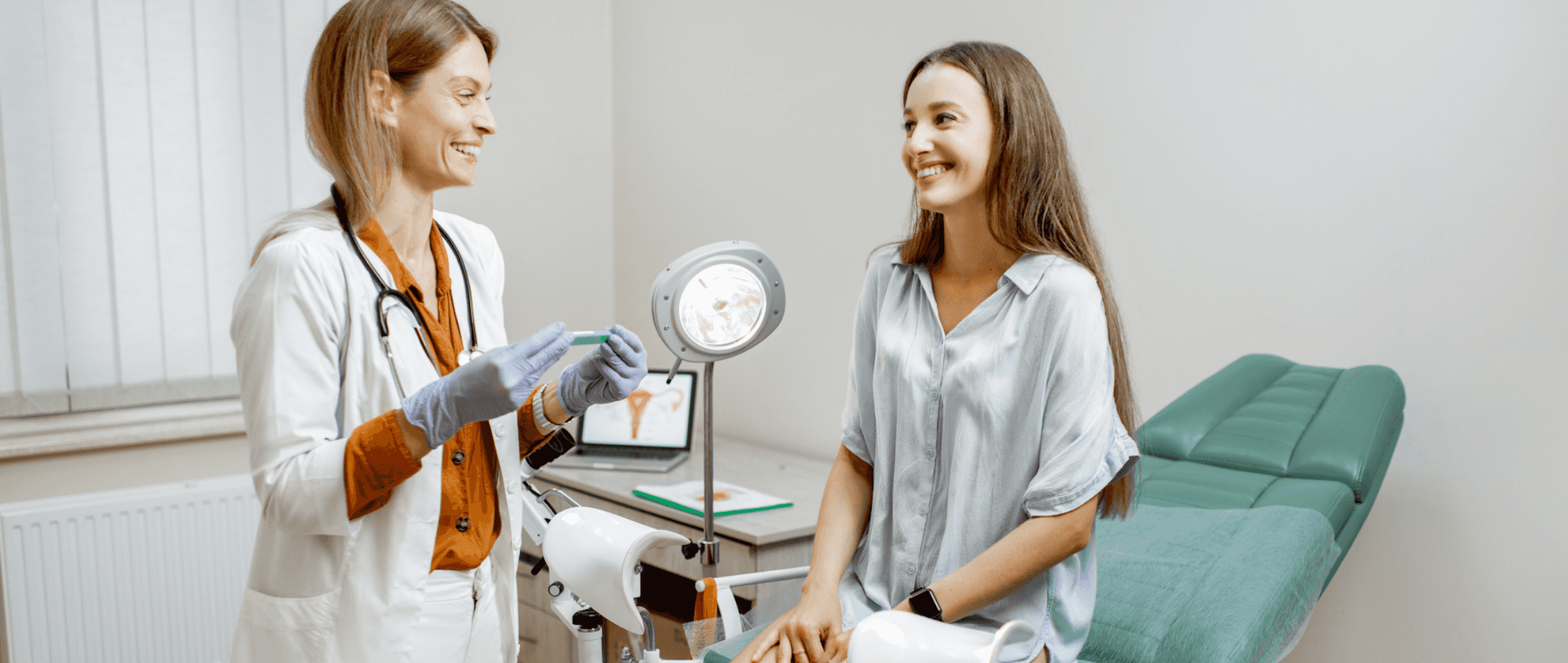 Female Gynecologist Smiling At Her Patient